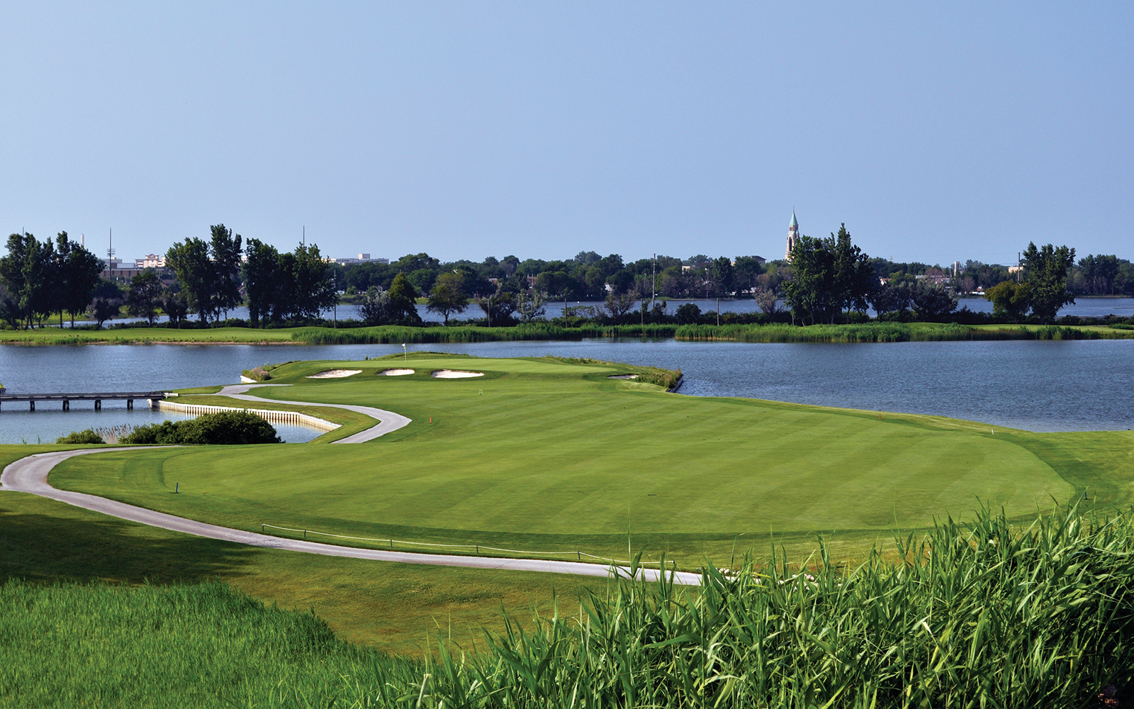 golf course with surrounding water